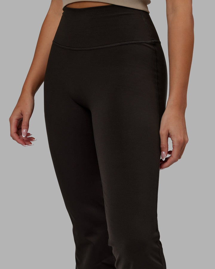 Woman wearing Everyday Flare Leggings - Dark Walnut