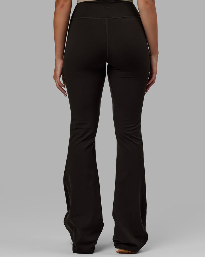 Woman wearing Everyday Flare Leggings - Dark Walnut