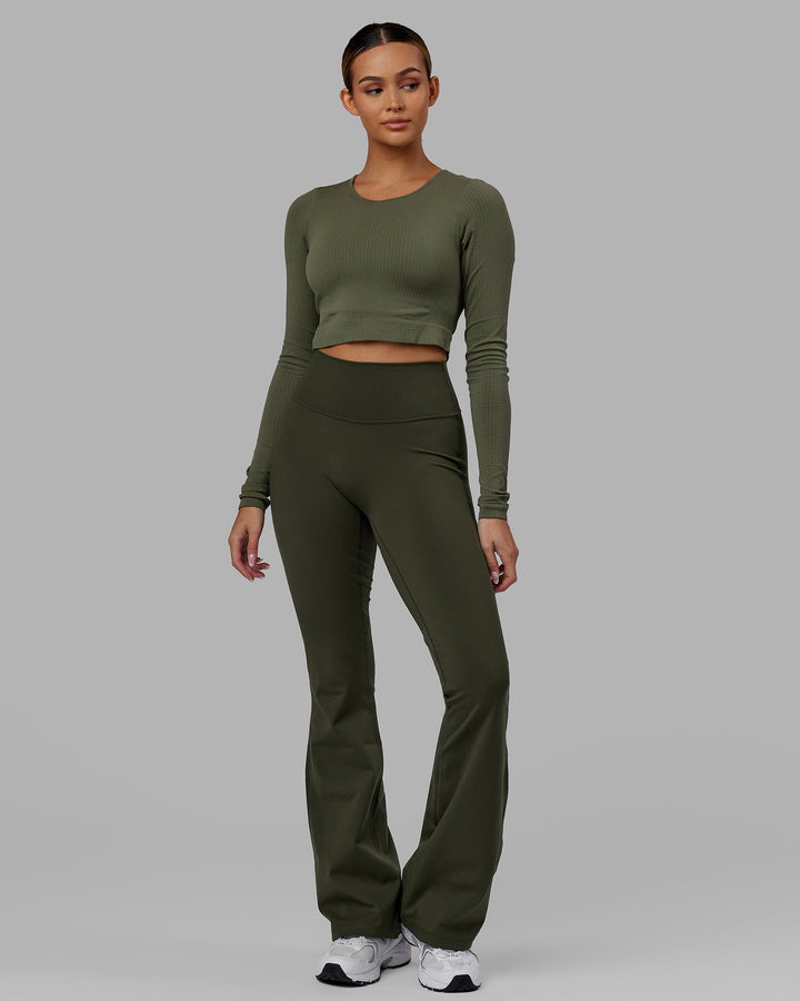 Woman wearing Everyday Flare Leggings - Forest Night
