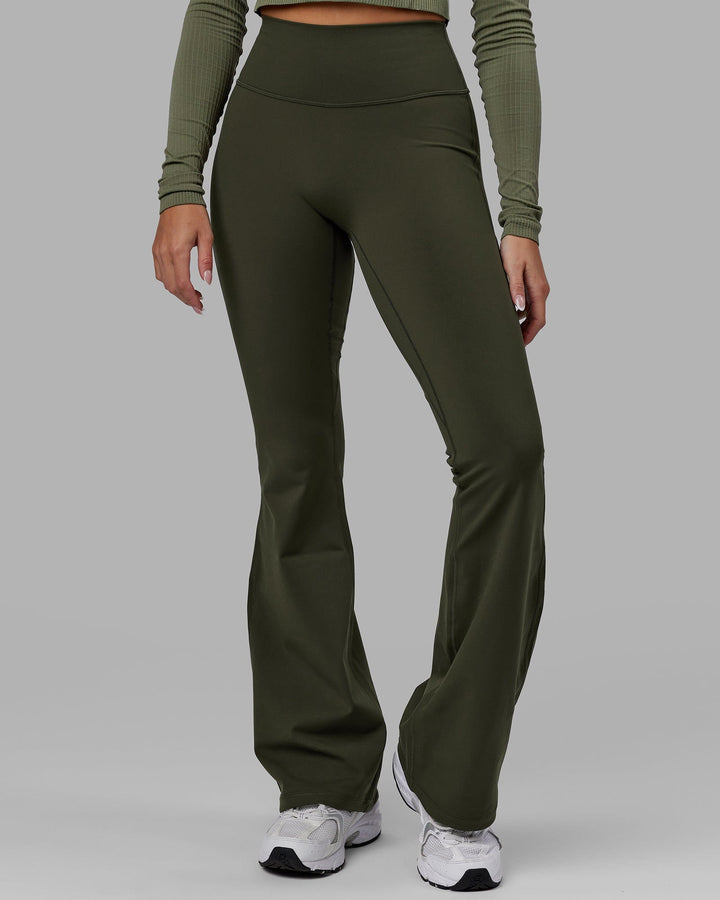 Woman wearing Everyday Flare Leggings - Forest Night