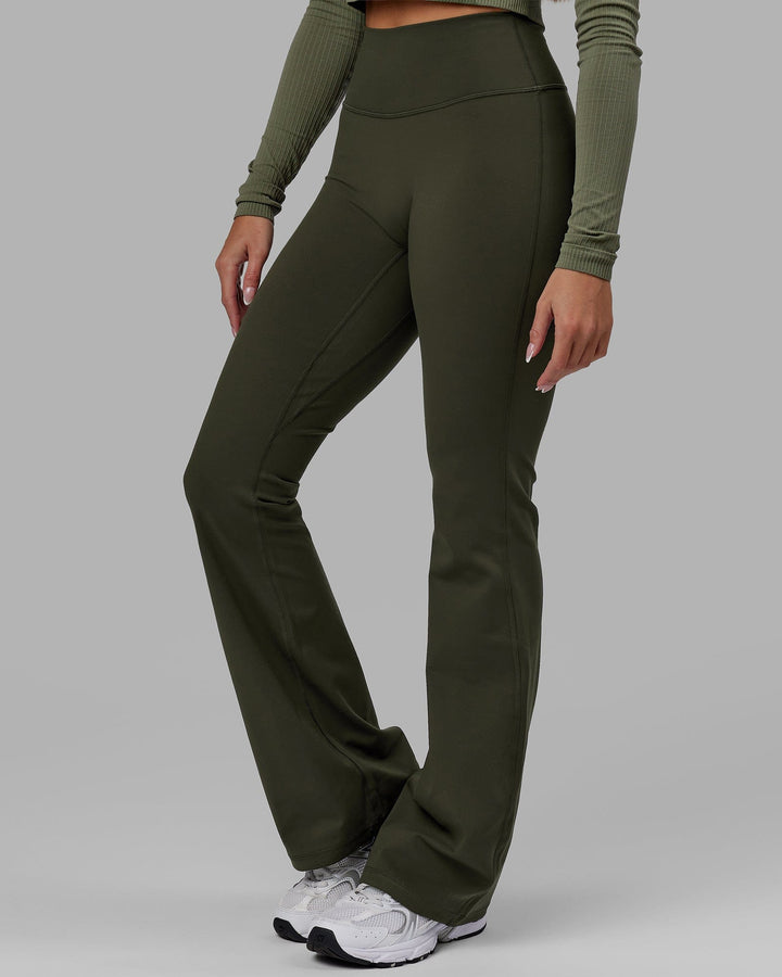 Woman wearing Everyday Flare Leggings - Forest Night
