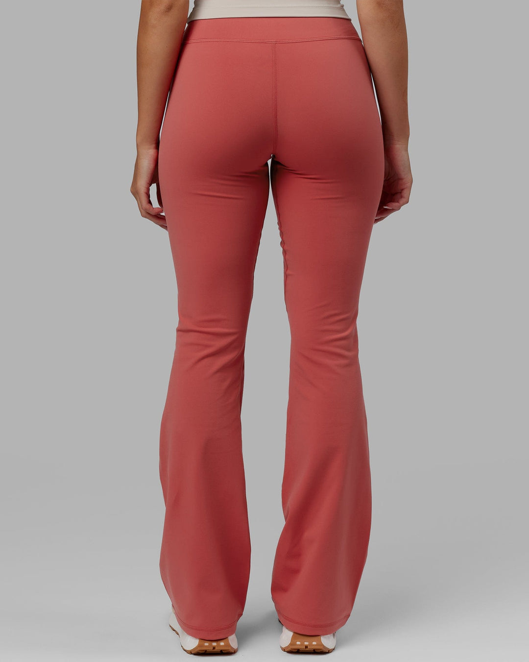 Woman wearing Everyday Flare Leggings - Mineral Red