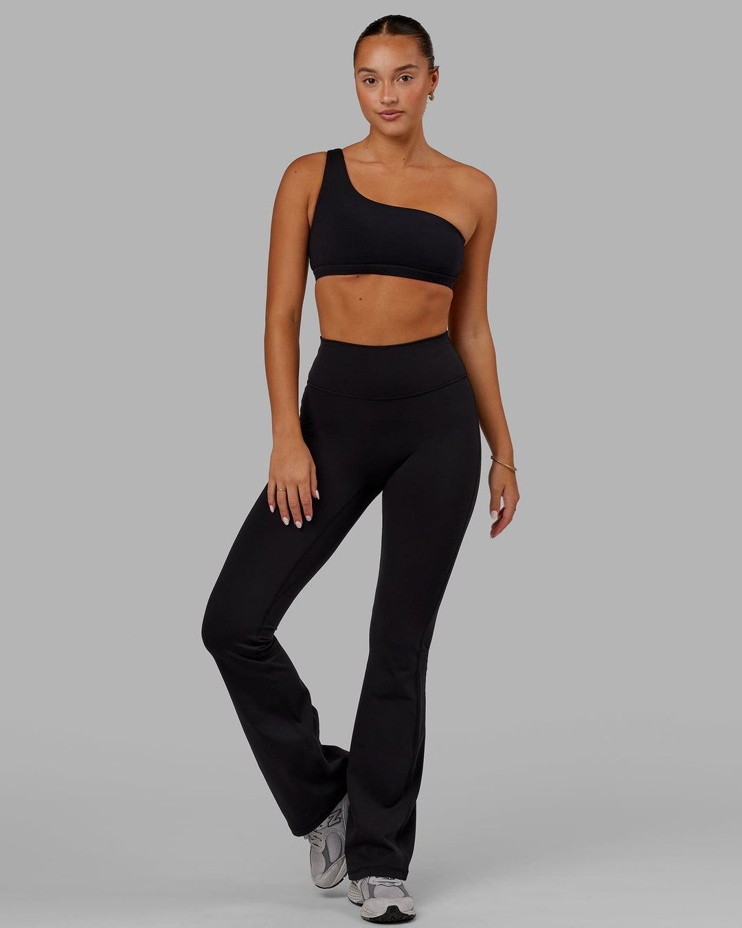 Woman wearing Fusion Ultra High-Rise Flared Legging - Black | Model:Milly | Size:S