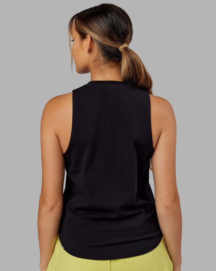Woman wearing Expand FLXCotton Tank - Black-Citrus Green