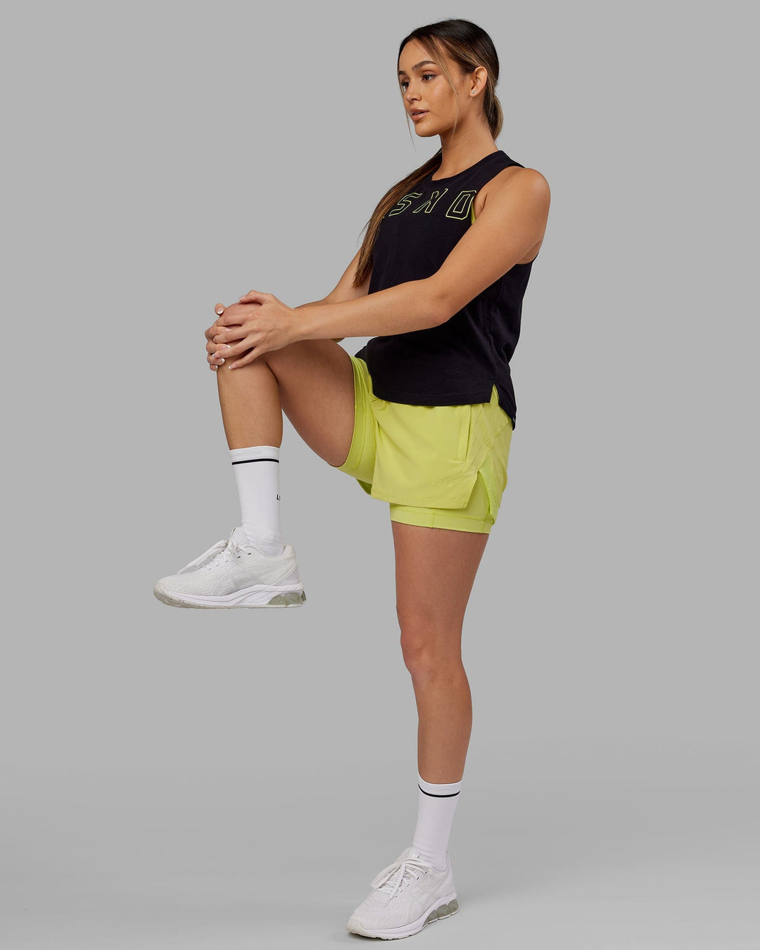 Woman wearing Expand FLXCotton Tank - Black-Citrus Green