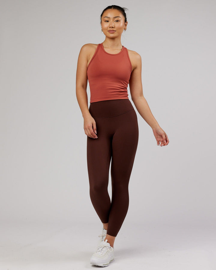 Woman wearing Flow Performance Tank - Marsala