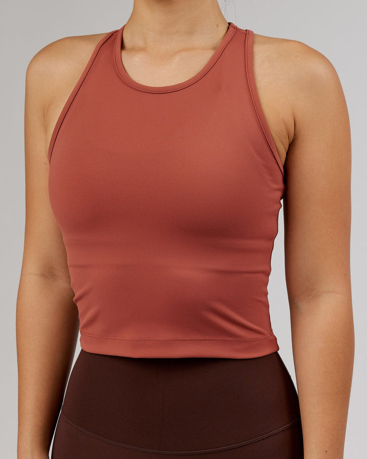 Woman wearing Flow Performance Tank - Marsala