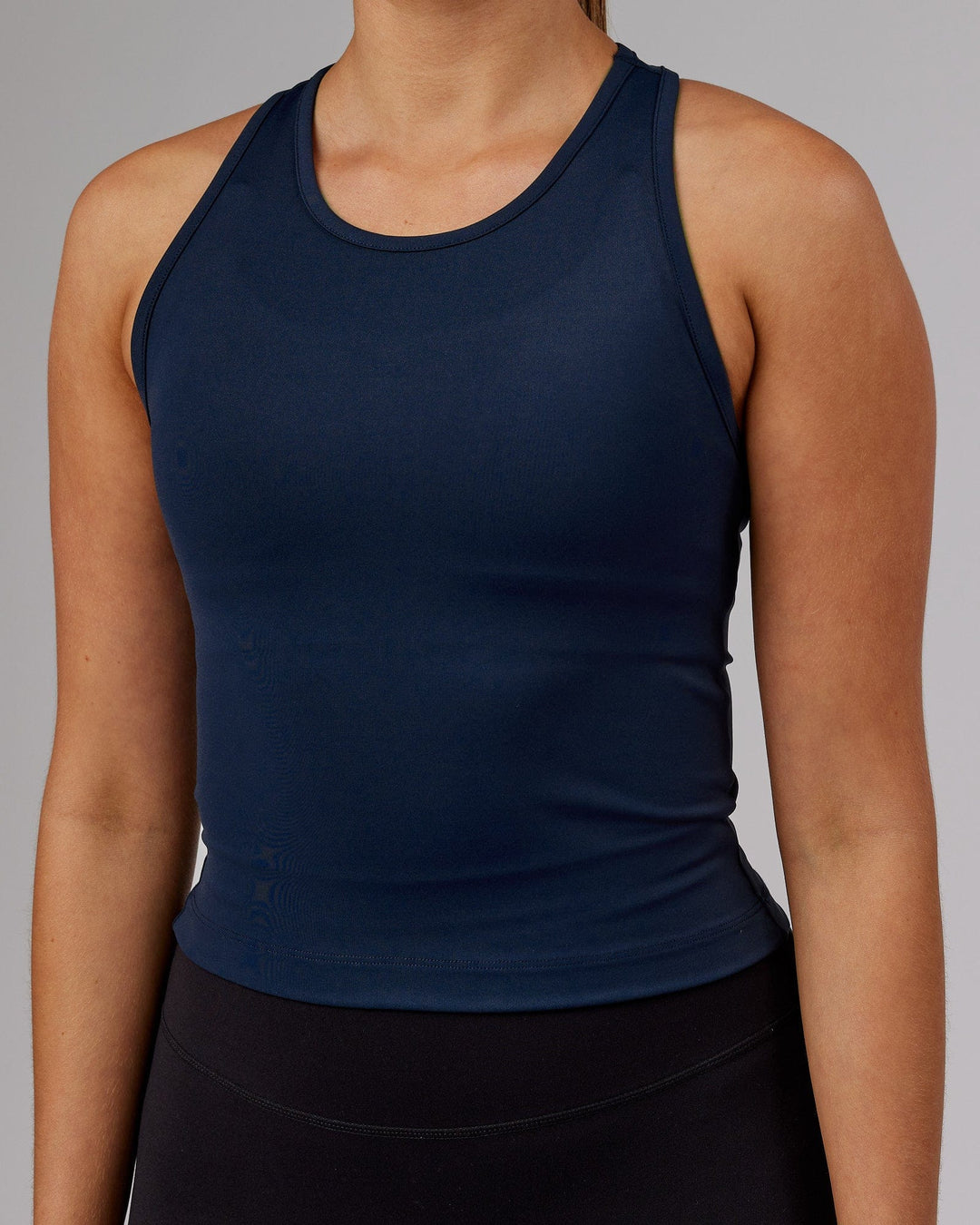 Woman wearing Flow Performance Tank - Navy