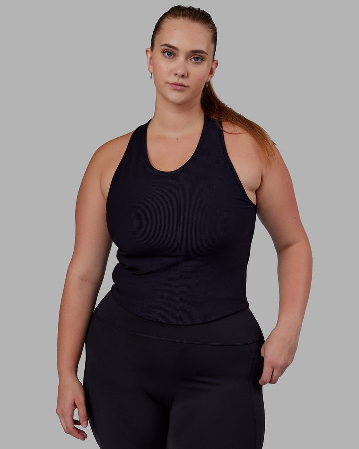 Woman wearing Flow Ribbed Shelf Bra Tank - Black
