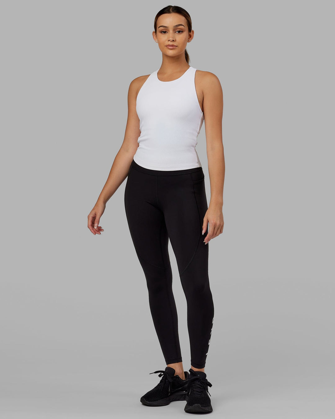 Woman wearing Flow Ribbed Shelf Bra Tank - White