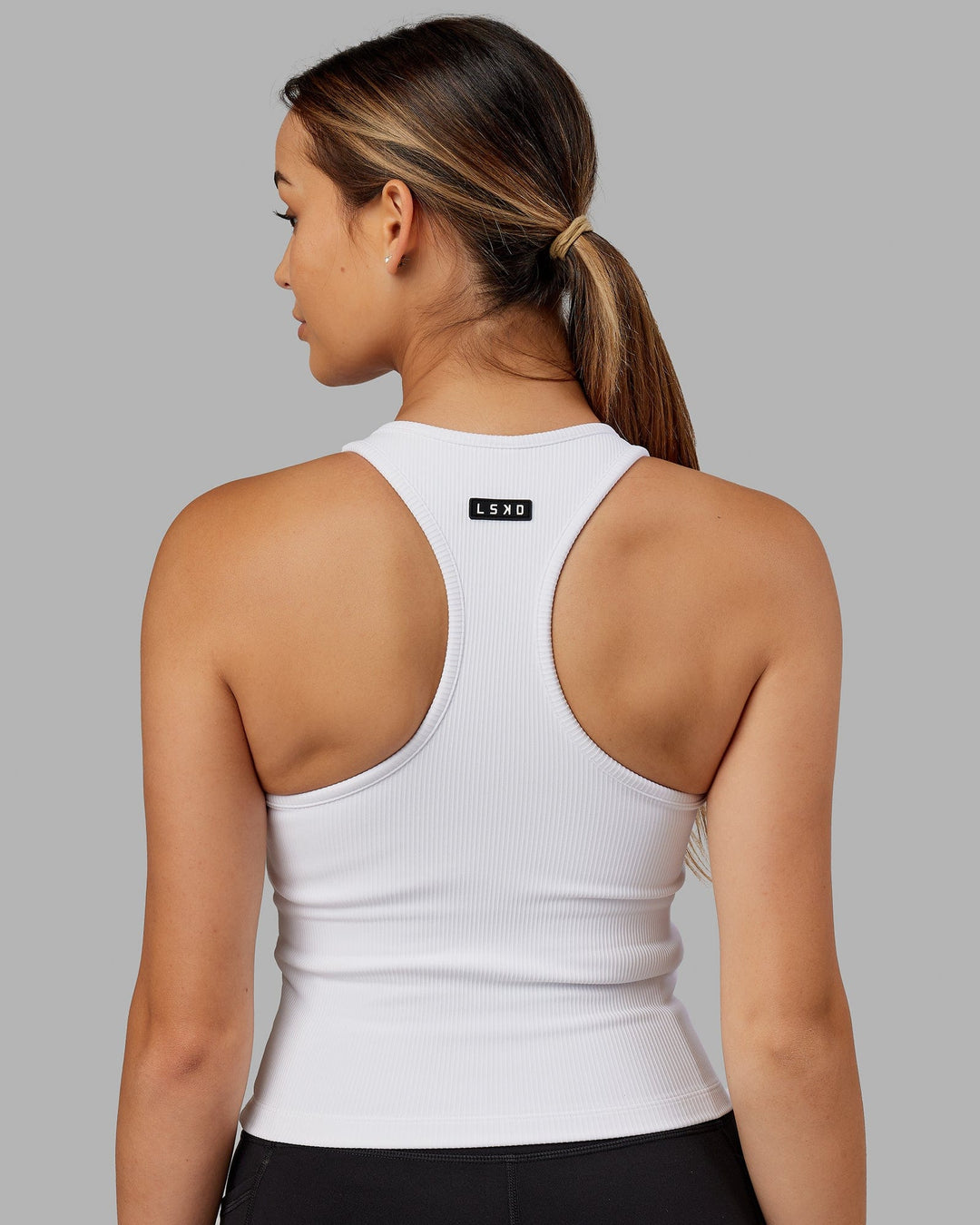 Woman wearing Flow Ribbed Shelf Bra Tank - White