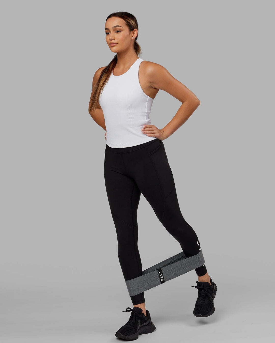 Woman wearing Flow Ribbed Shelf Bra Tank - White