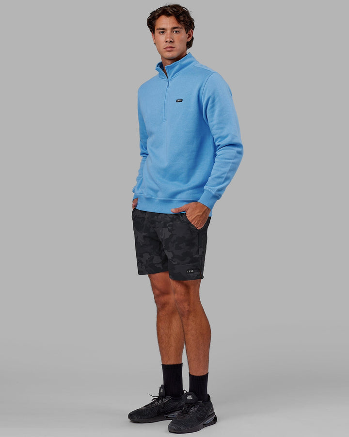 Man wearing Unisex Fundamental 1/4 Zip Sweater - Azure Blue
