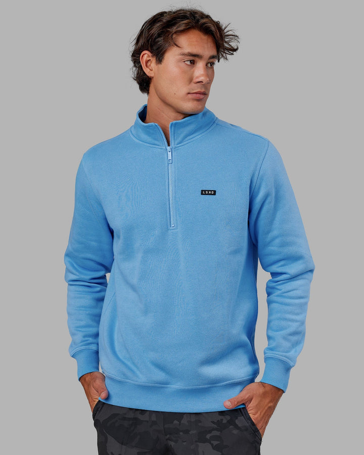 Man wearing Unisex Fundamental 1/4 Zip Sweater - Azure Blue