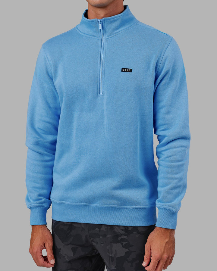 Man wearing Unisex Fundamental 1/4 Zip Sweater - Azure Blue
