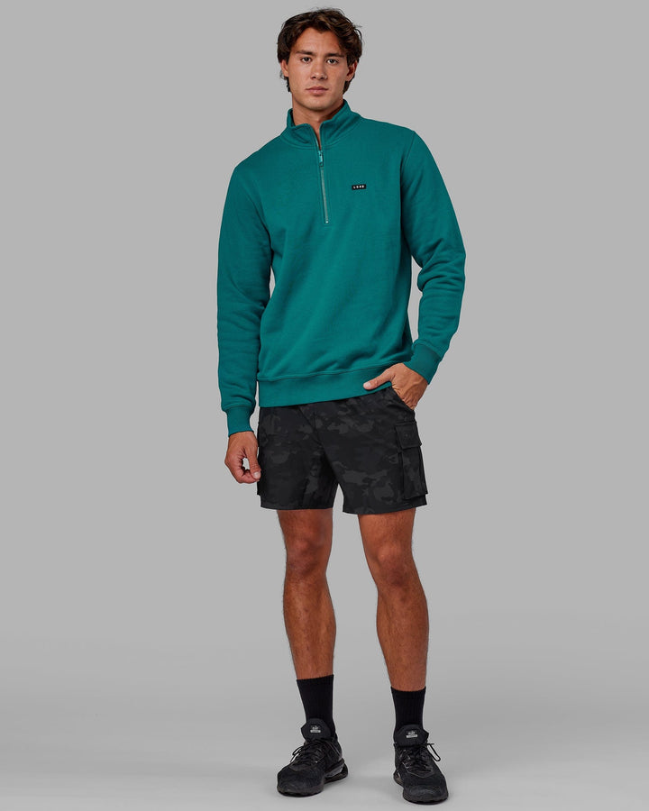 Man wearing Unisex Fundamental 1/4 Zip Sweater - Deep Lake