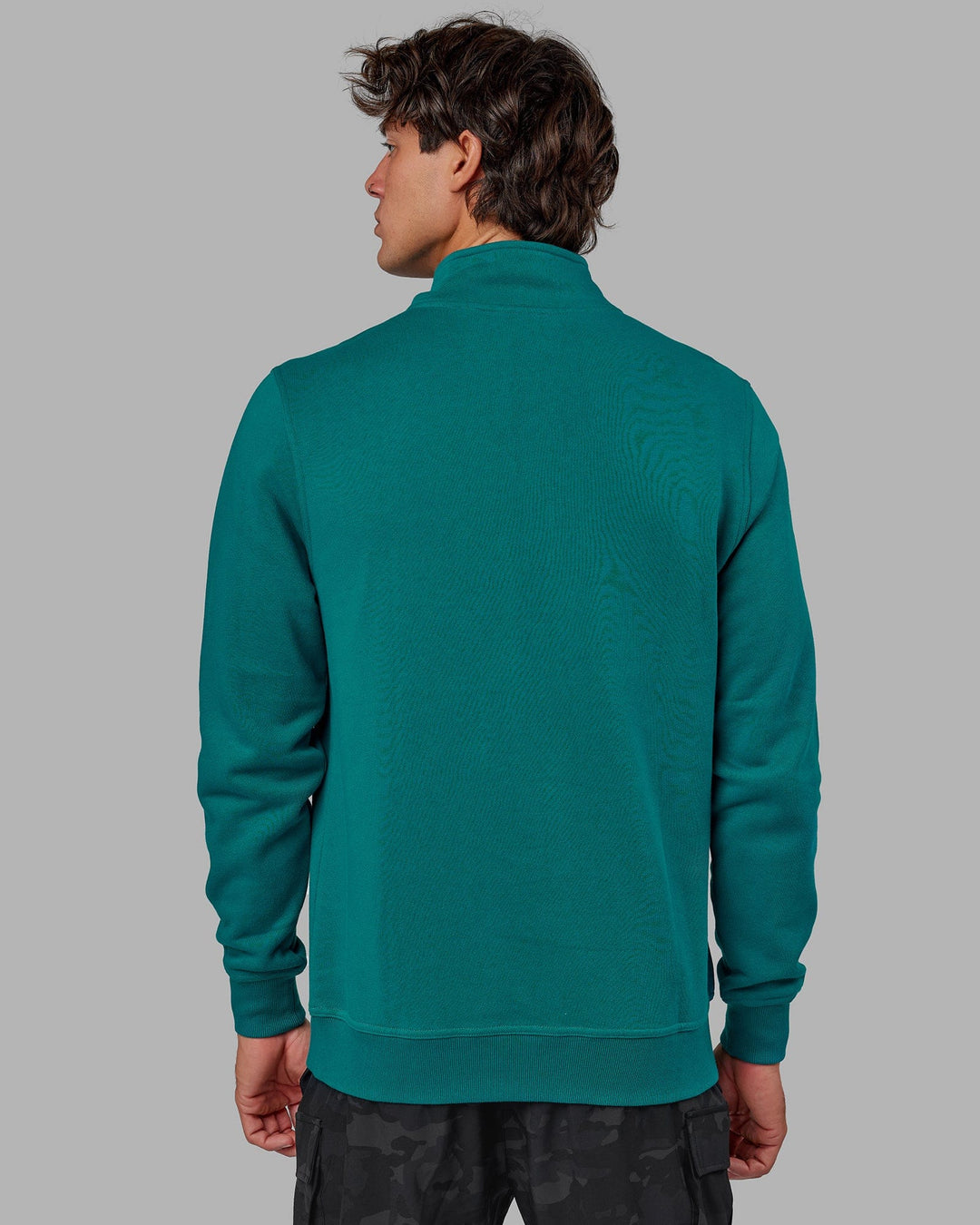 Man wearing Unisex Fundamental 1/4 Zip Sweater - Deep Lake