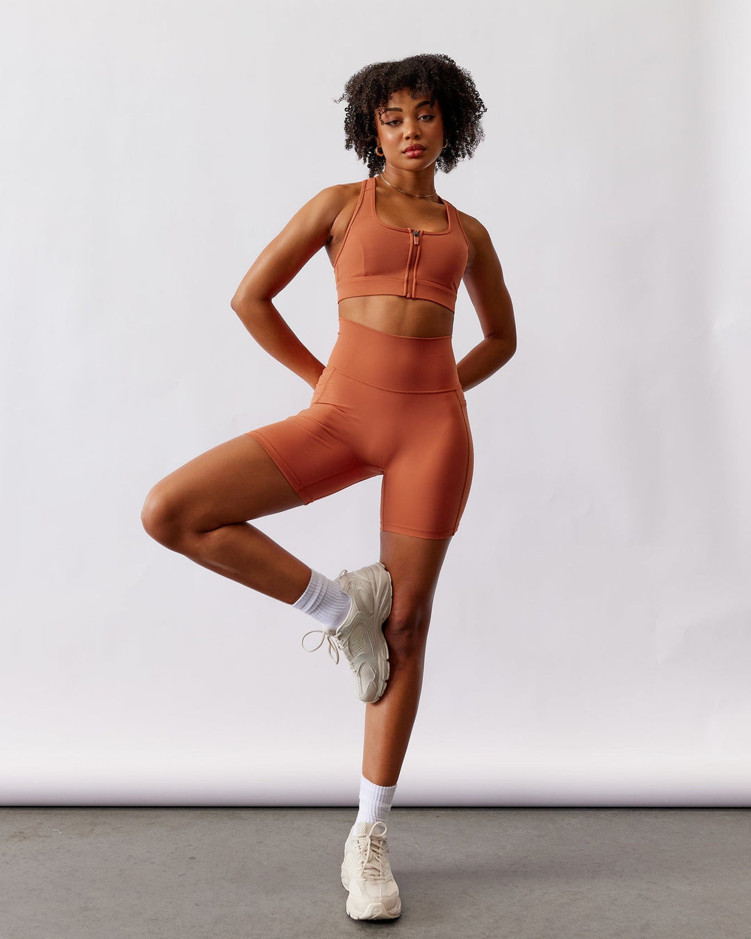 Woman wearing Fusion Mid Short Tight - Auburn