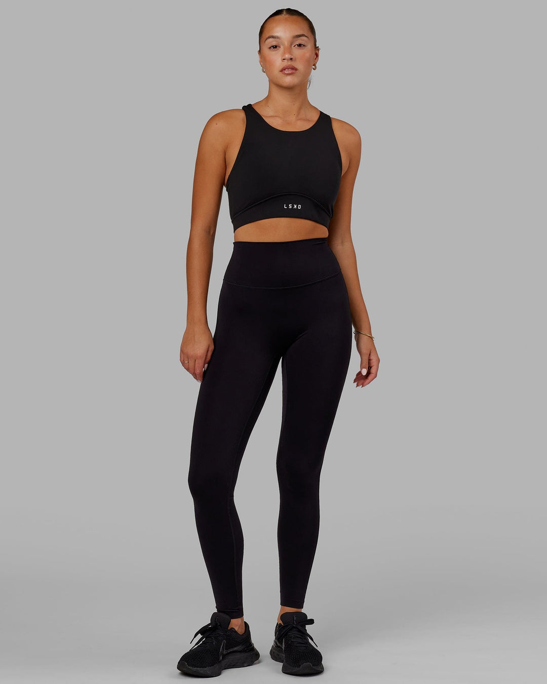 Woman Wearing Fusion Sports Bra - Black