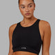 Woman Wearing Fusion Sports Bra - Black