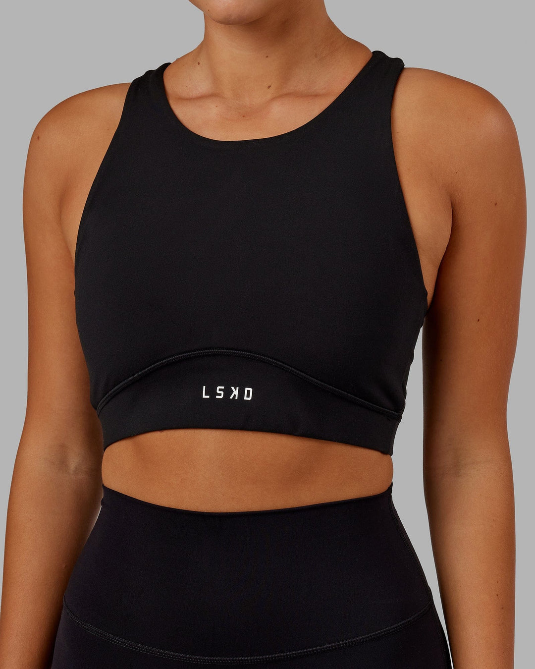 Woman Wearing Fusion Sports Bra - Black