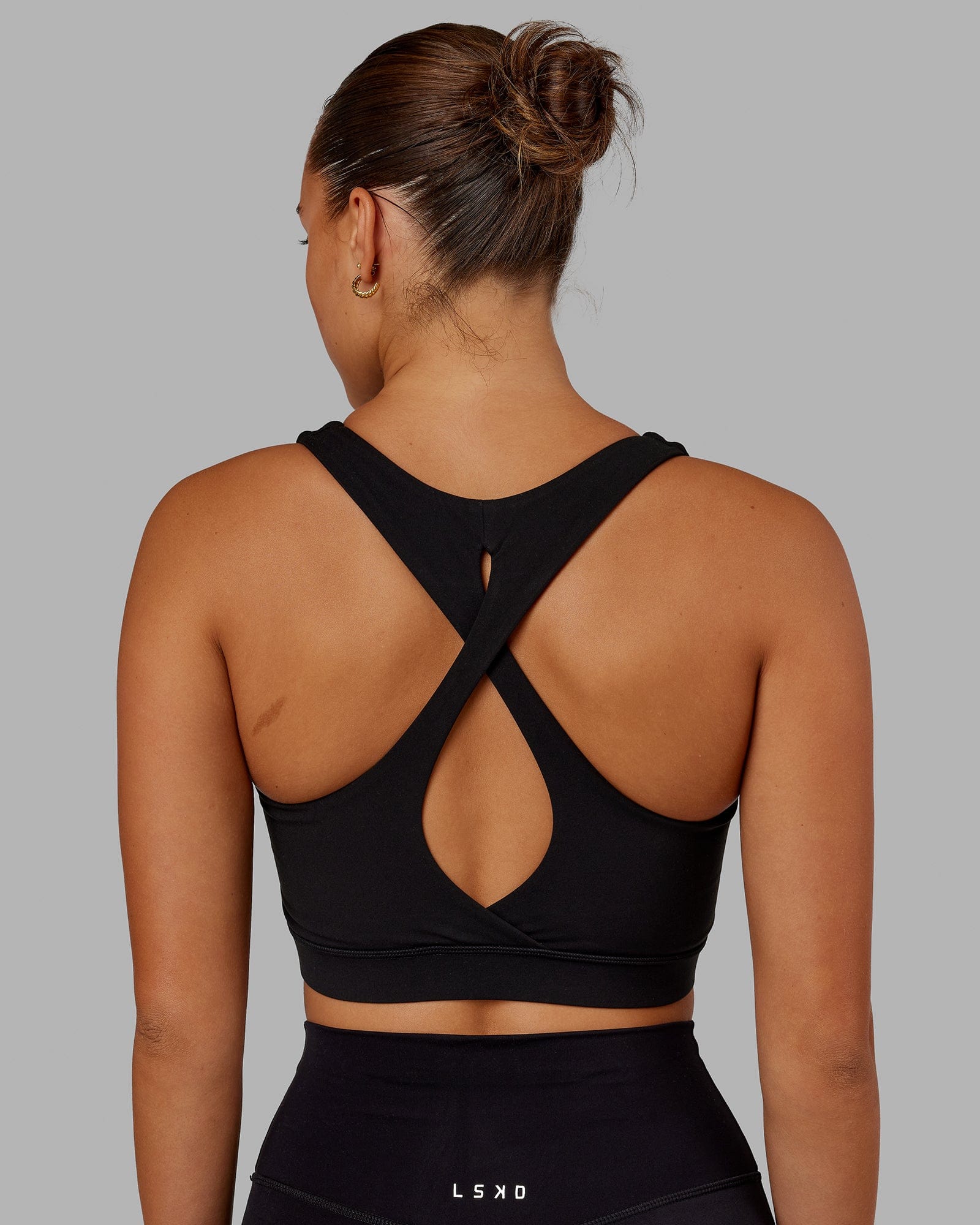 Woman Wearing Fusion Sports Bra - Black