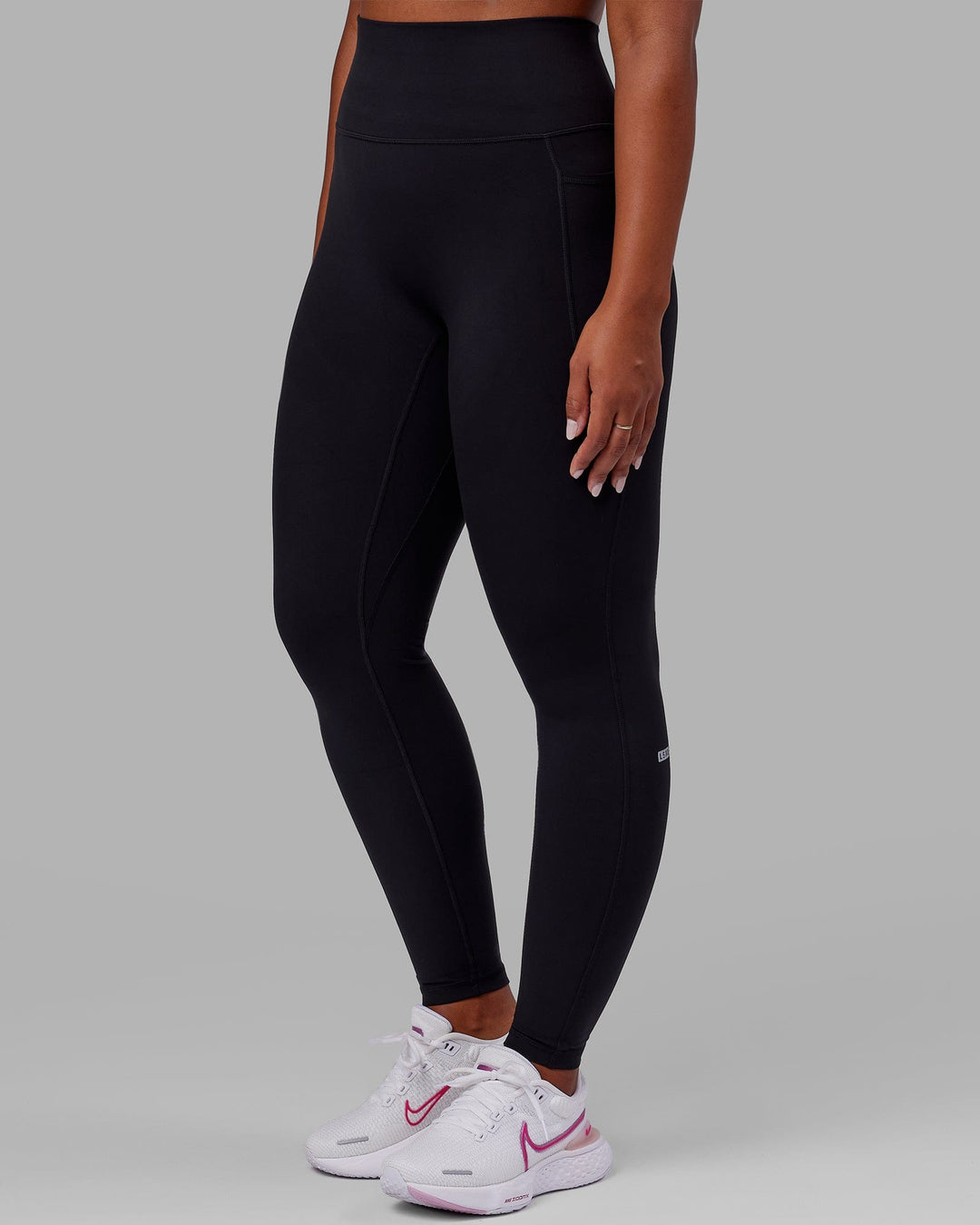 Woman wearing O.G. Fusion Ultra High-Rise Tall Legging Pockets - Black | Model:Sierra | Size:L