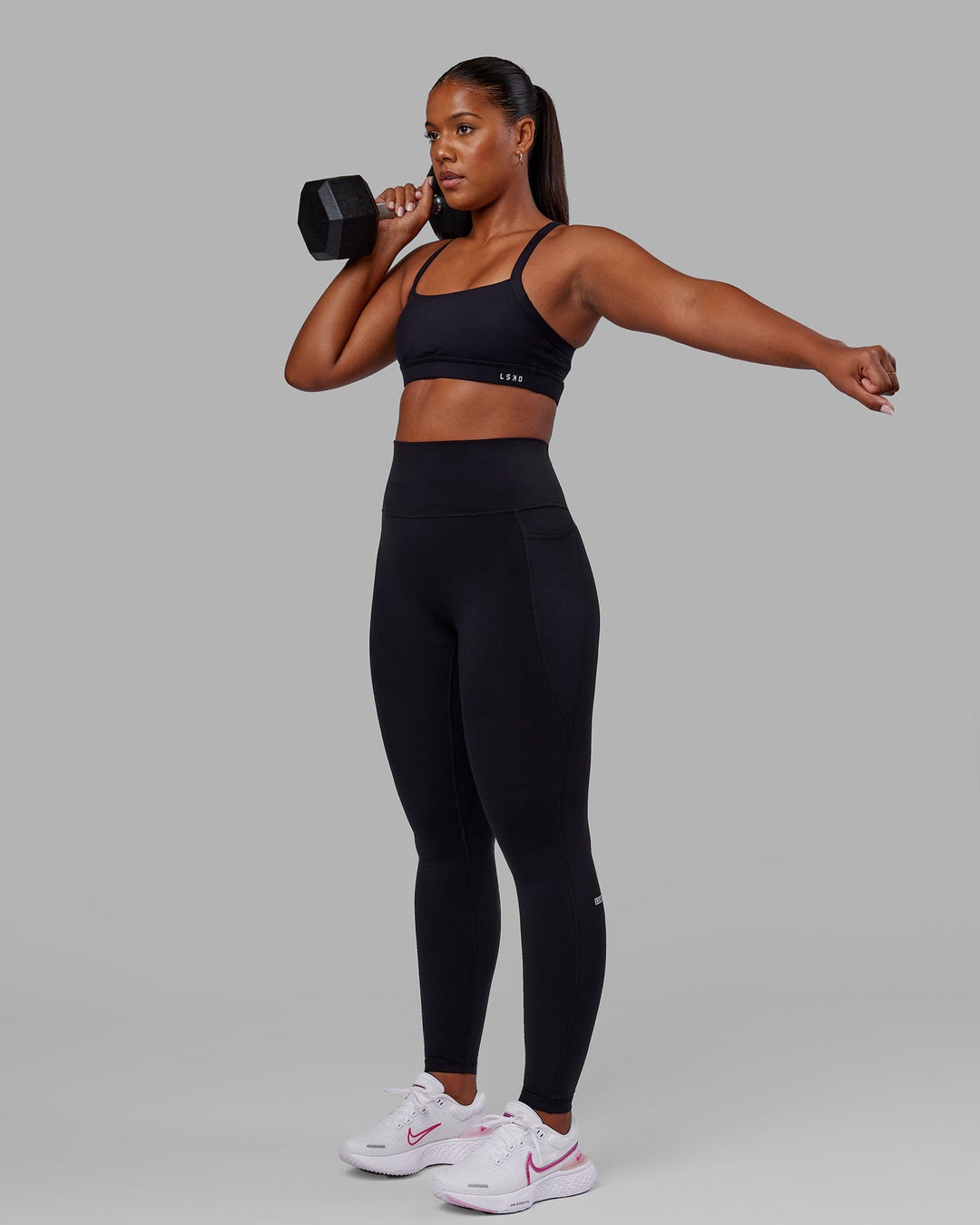 Woman wearing O.G. Fusion Ultra High-Rise Tall Legging Pockets - Black | Model:Sierra | Size:L
