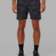 Man wearing Intensity 7'' Performance Short - Black-Camo