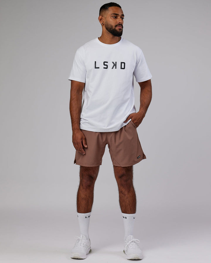 Man wearing Intensity 7'' Performance Short - Deep Taupe
