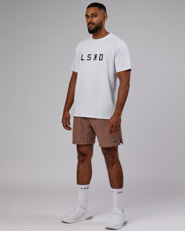 Man wearing Intensity 7'' Performance Short - Deep Taupe