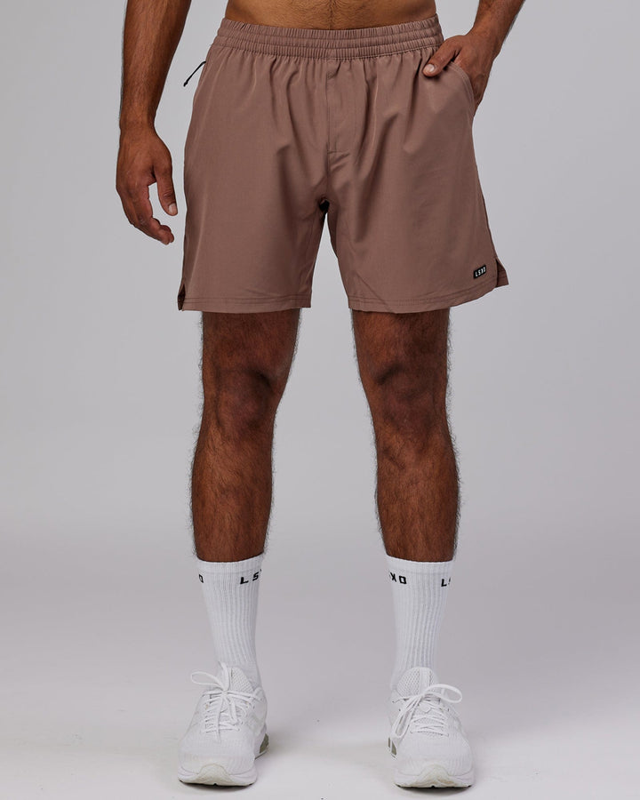 Man wearing Intensity 7'' Performance Short - Deep Taupe