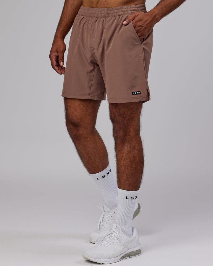Man wearing Intensity 7'' Performance Short - Deep Taupe