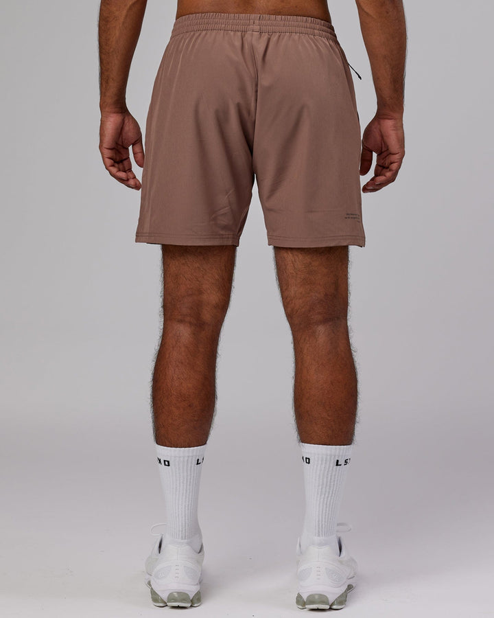 Man wearing Intensity 7'' Performance Short - Deep Taupe