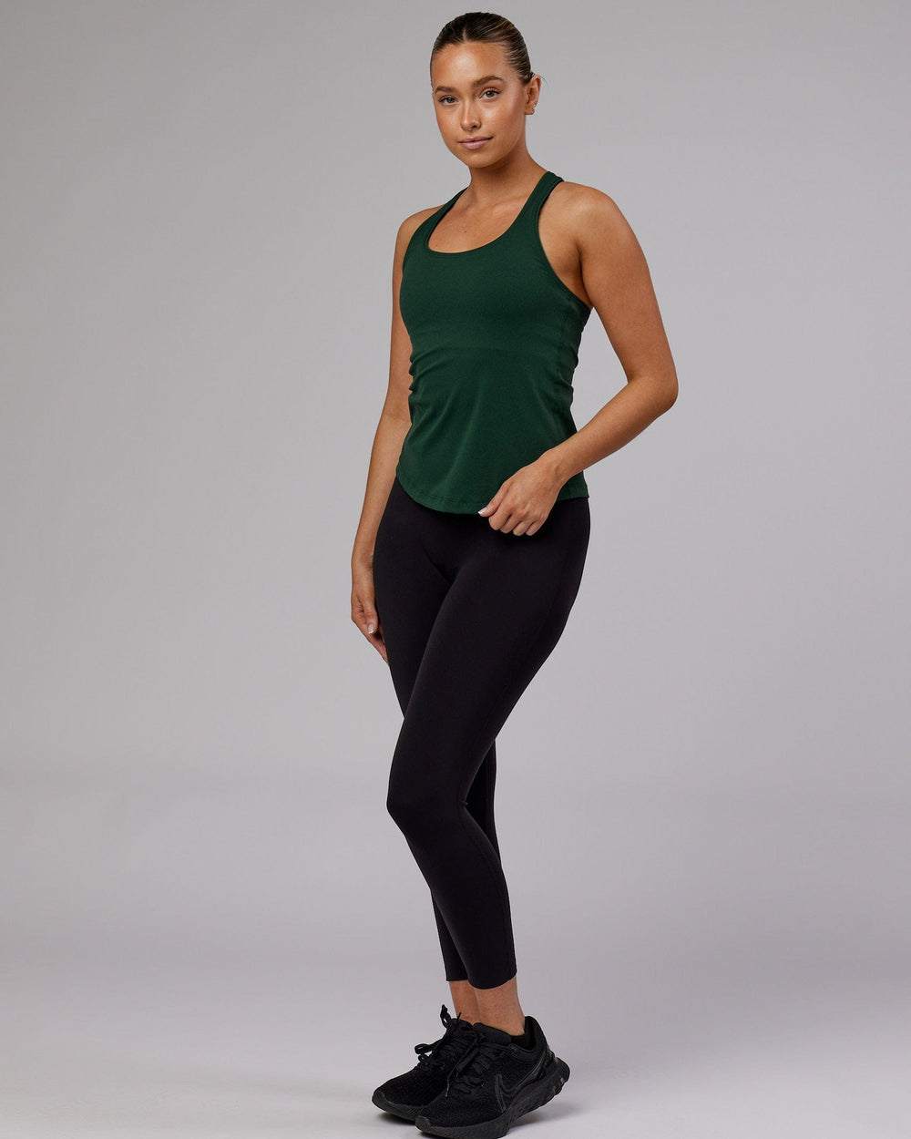 Woman wearing Lift Performance Tank - Vital Green
