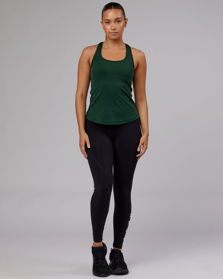 Woman wearing Lift Shelf Bra Performance Tank - Vital Green