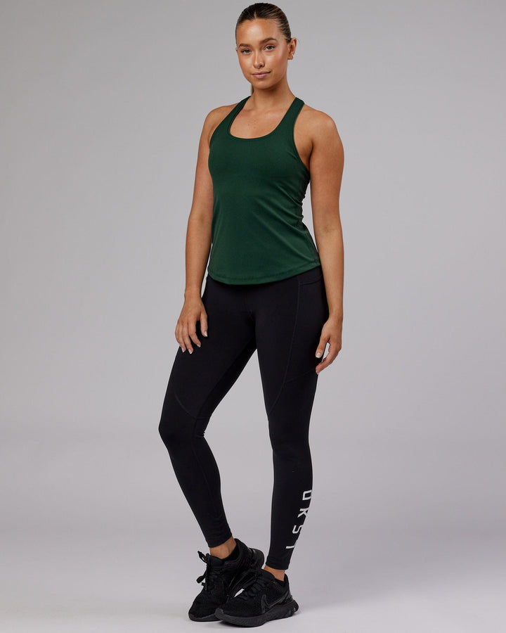 Woman wearing Lift Shelf Bra Performance Tank - Vital Green