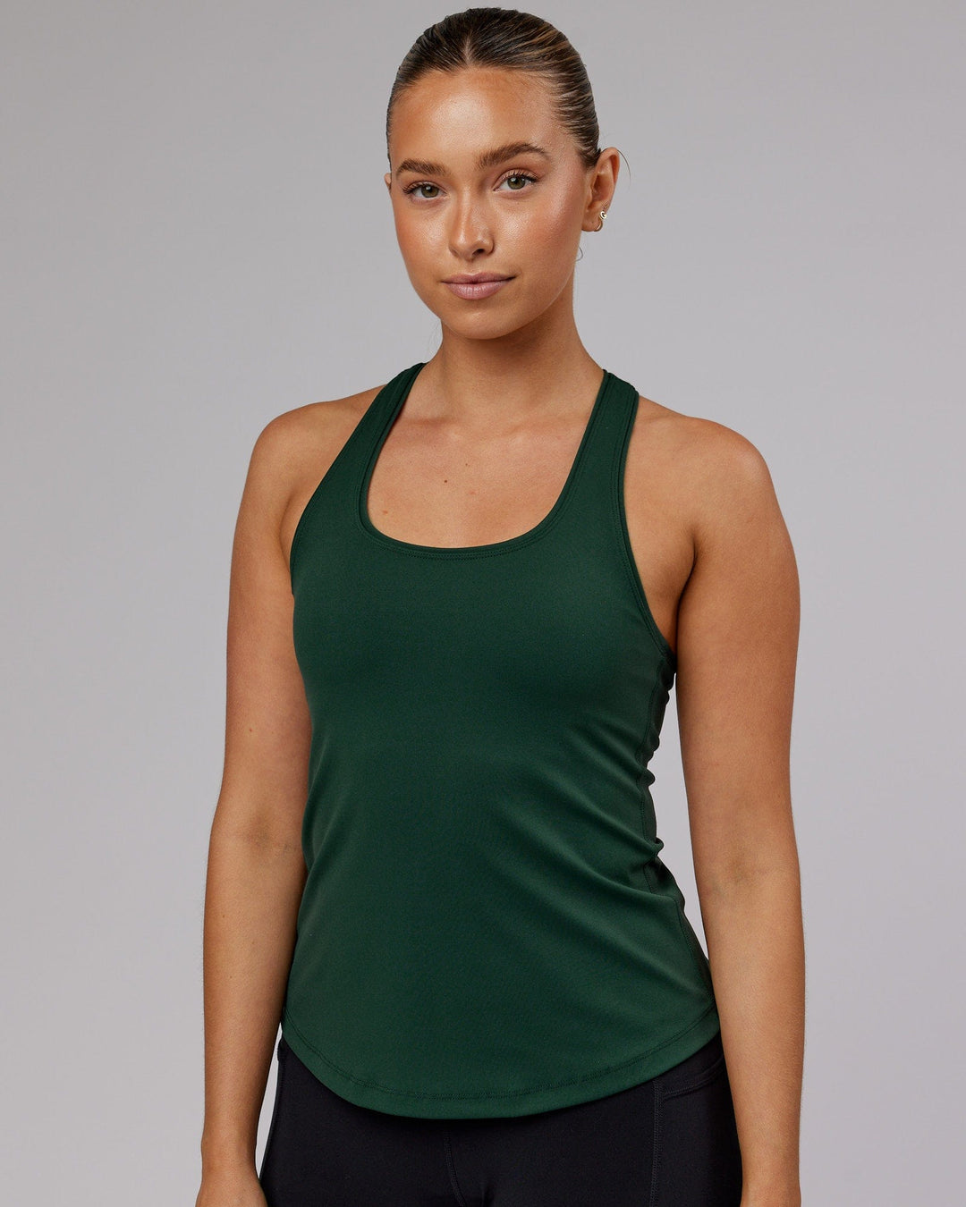 Woman wearing Lift Shelf Bra Performance Tank - Vital Green