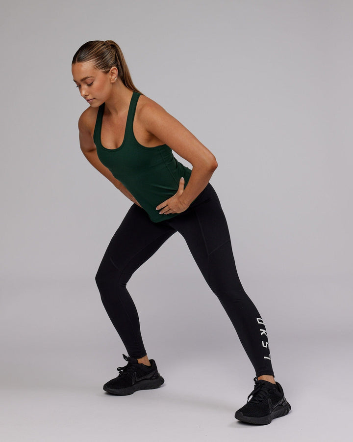 Woman wearing Lift Shelf Bra Performance Tank - Vital Green