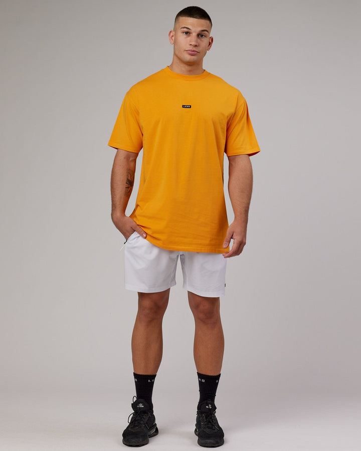 Man wearing Fundamental FLXCotton Tee Longline Oversize - Butterscotch