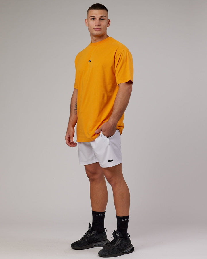 Man wearing Fundamental FLXCotton Tee Longline Oversize - Butterscotch