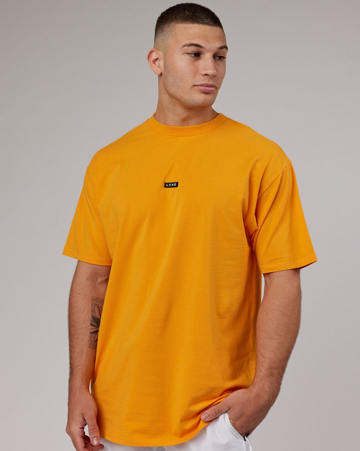Man wearing Fundamental FLXCotton Tee Longline Oversize - Butterscotch