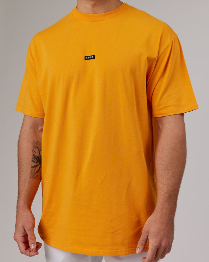 Man wearing Fundamental FLXCotton Tee Longline Oversize - Butterscotch