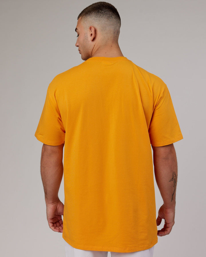 Man wearing Fundamental FLXCotton Tee Longline Oversize - Butterscotch