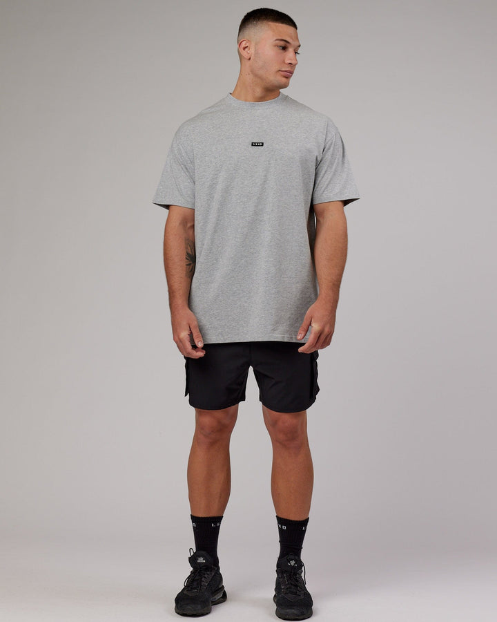 Man wearing Fundamental FLXCotton Tee Longline Oversize - Lt Grey Marl