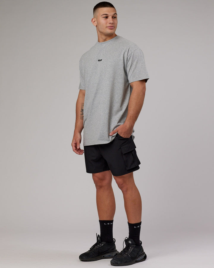 Man wearing Fundamental FLXCotton Tee Longline Oversize - Lt Grey Marl