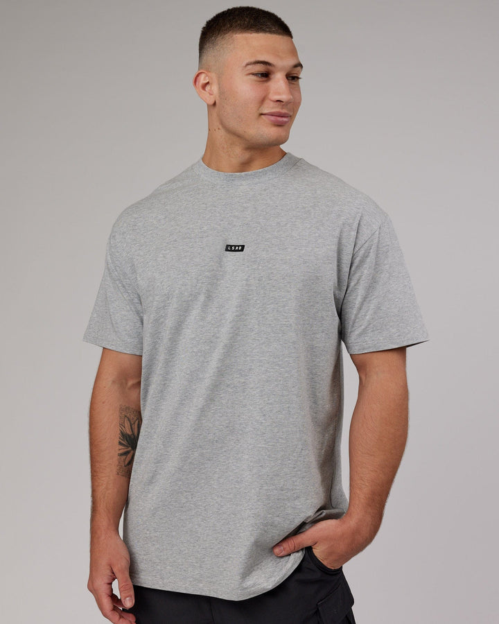 Man wearing Fundamental FLXCotton Tee Longline Oversize - Lt Grey Marl