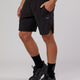 Man wearing Competition 8" Performance Short - Black