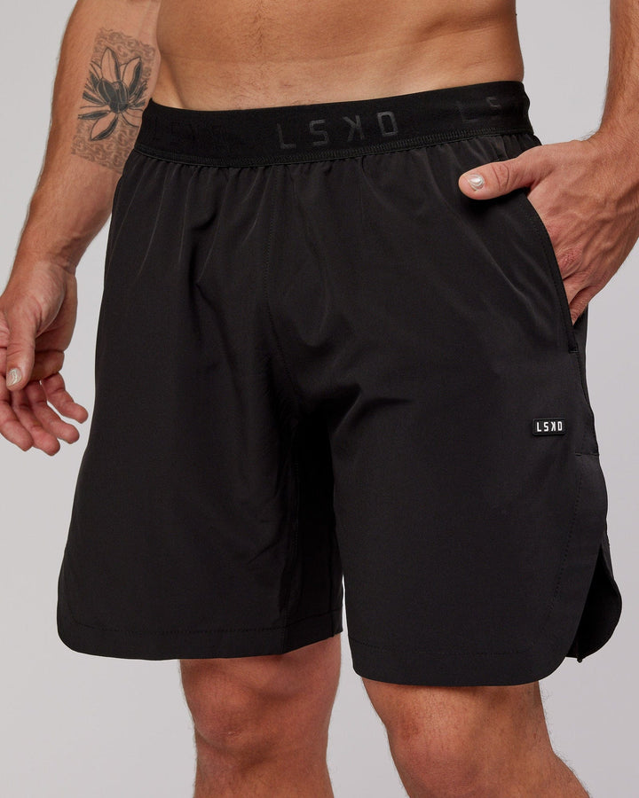 Man wearing Competition 8" Performance Short - Black