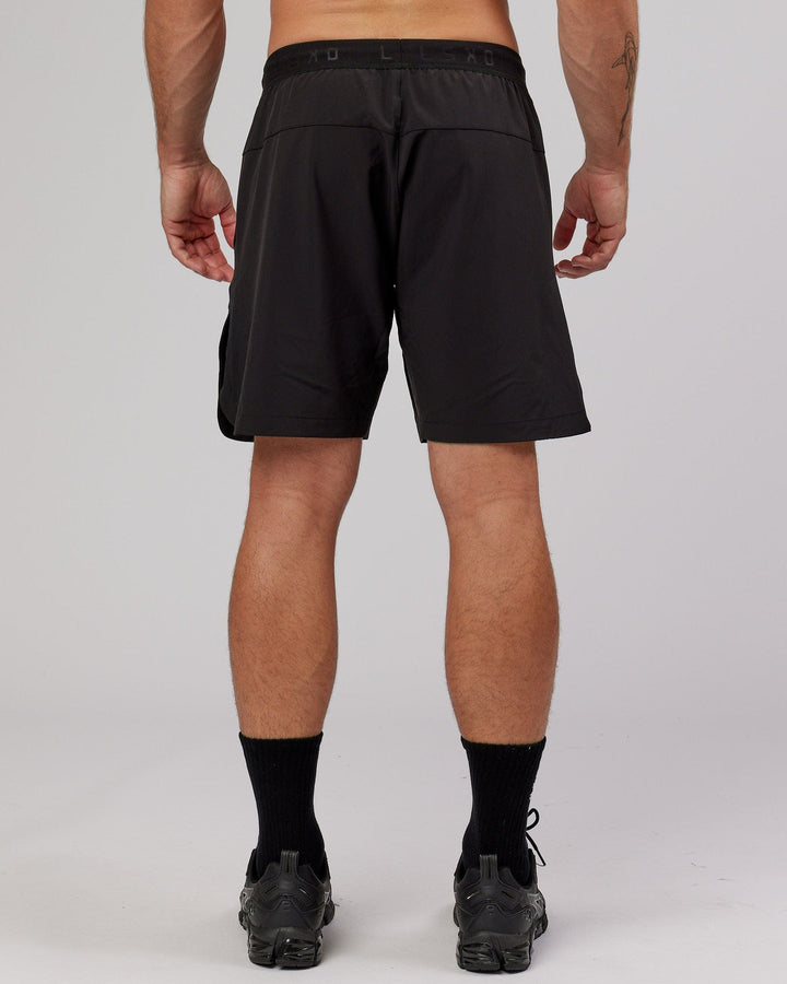 Man wearing Competition 8" Performance Short - Black